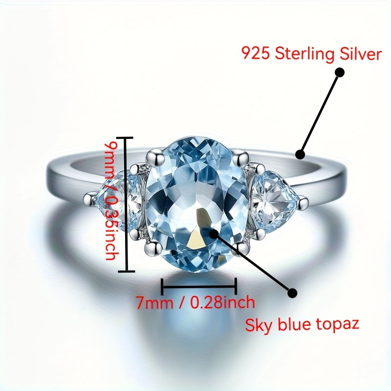 Custom Sky Blue Topaz Three-Stone Oval Ring