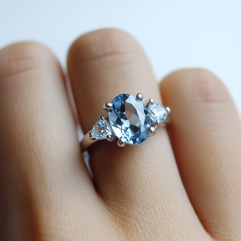 Custom Sky Blue Topaz Three-Stone Oval Ring